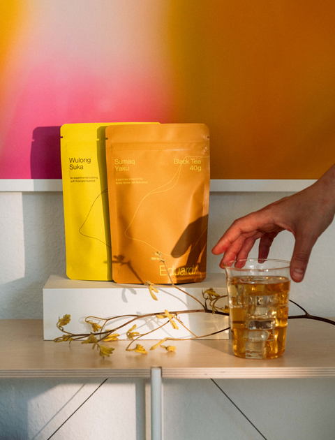 Andes Experience pouches next to a glass of tea