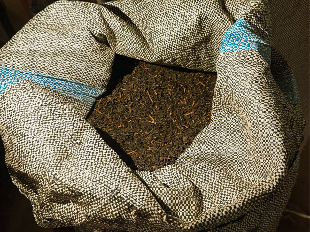 Open sack of dried tea leaves