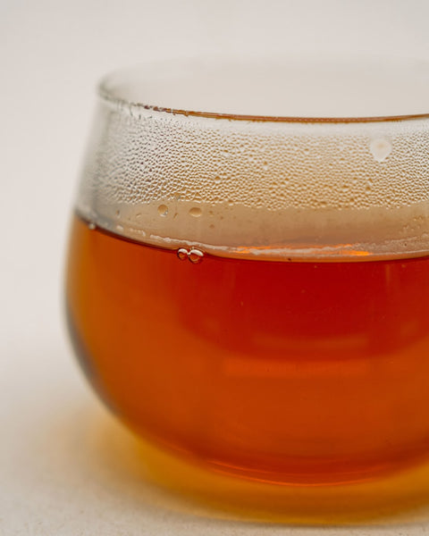 Amber infusion of Second Musk Flush in a glass