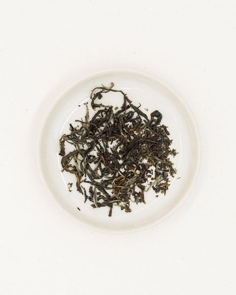 Dry leaves of Wulong Suka on a plate